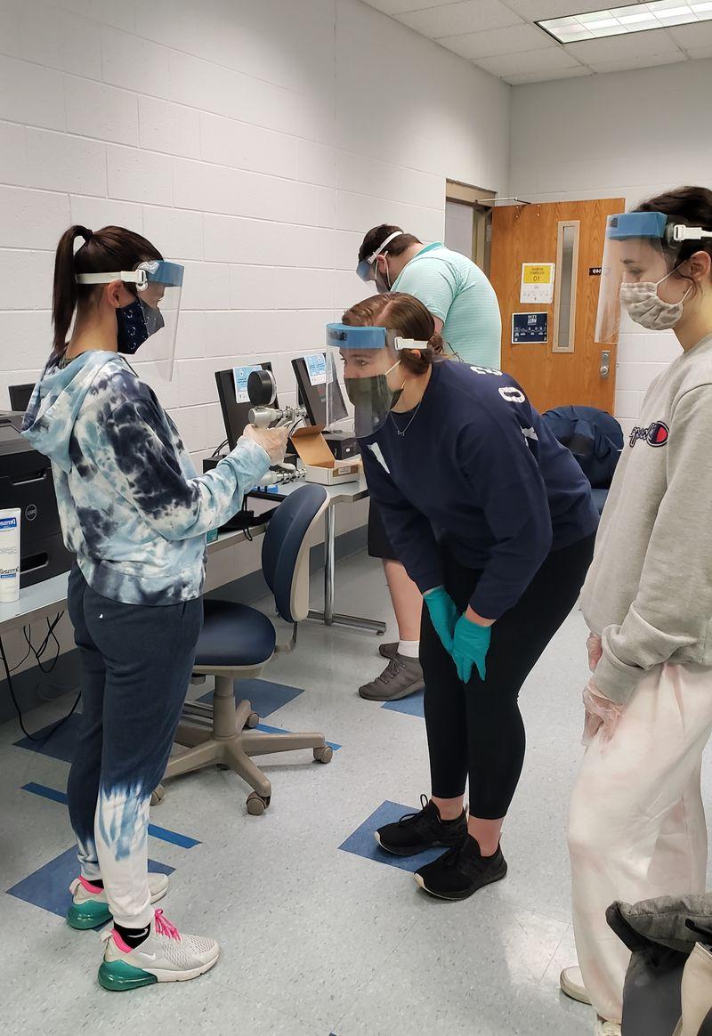 Level I fieldwork simulated clinical experience with students completing hands-on assessments.